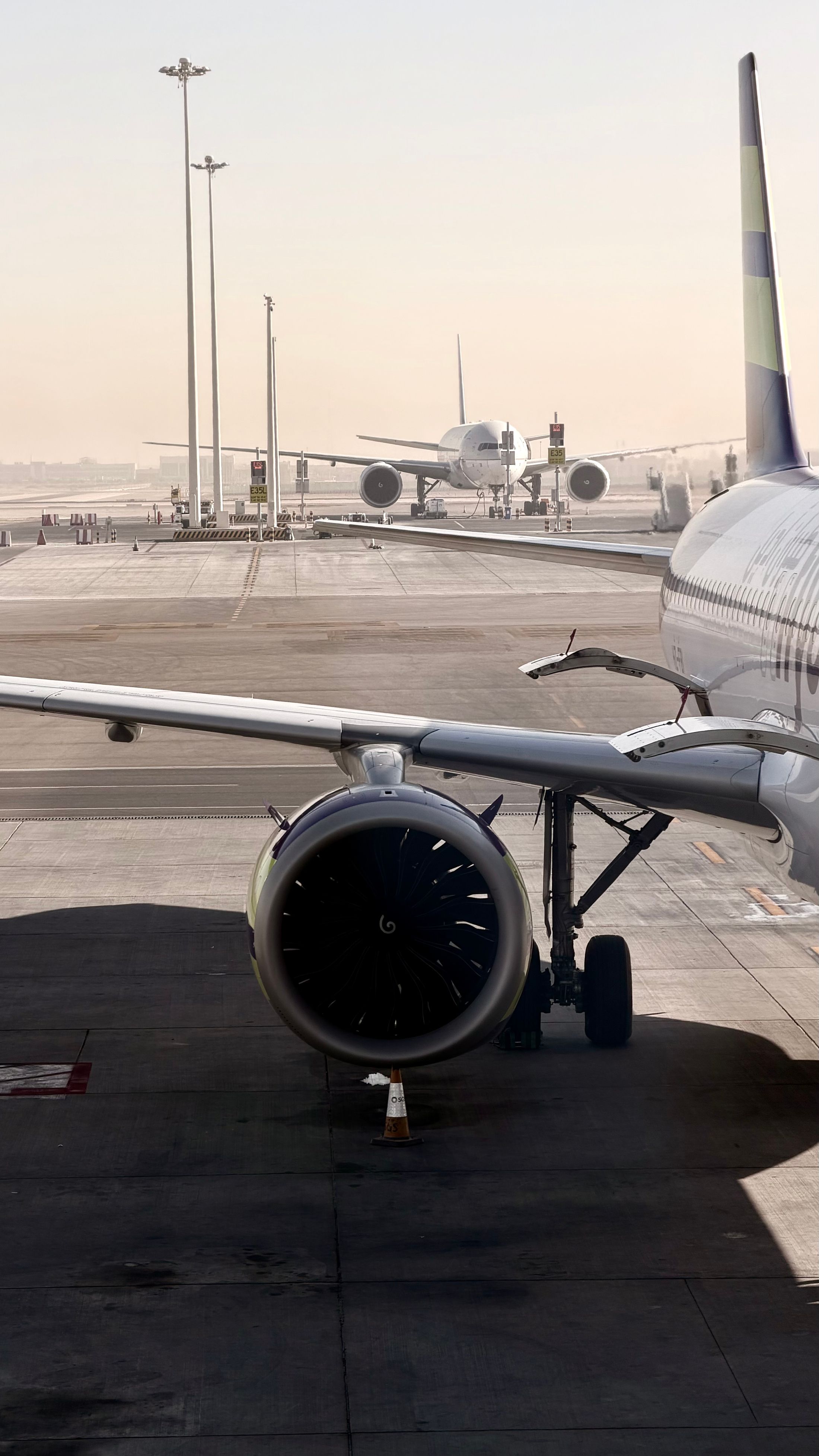 Close view of a modern aircraft and jet engine at the airport