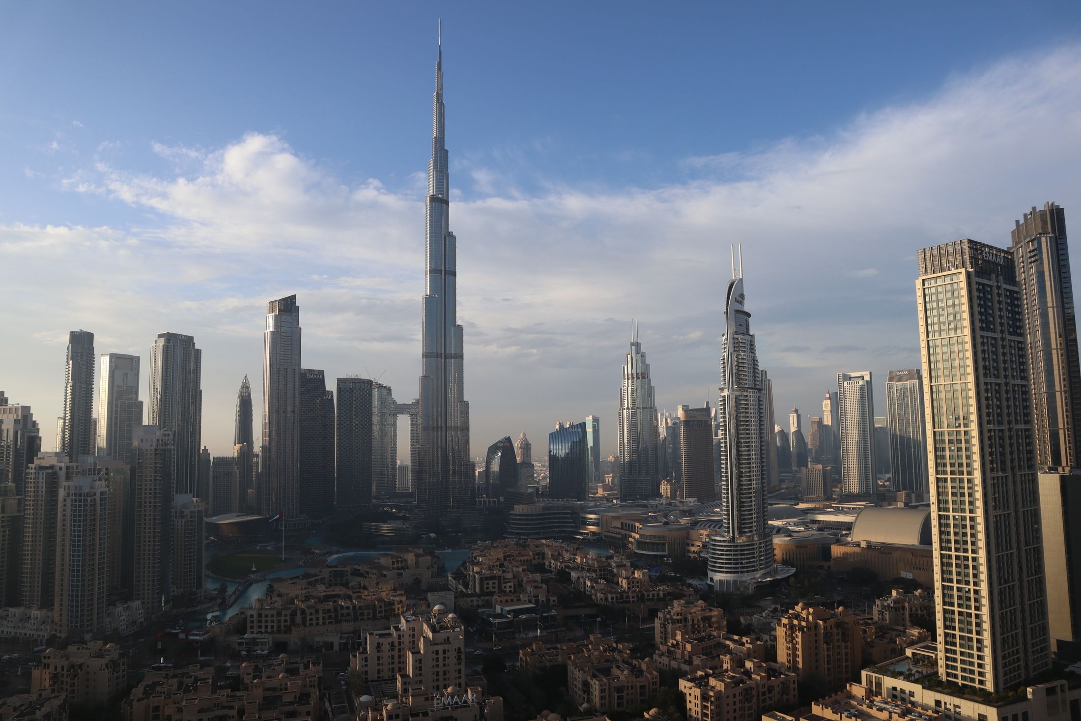 Modern Dubai skyline with the Burj Khalifa under a clear blue sky