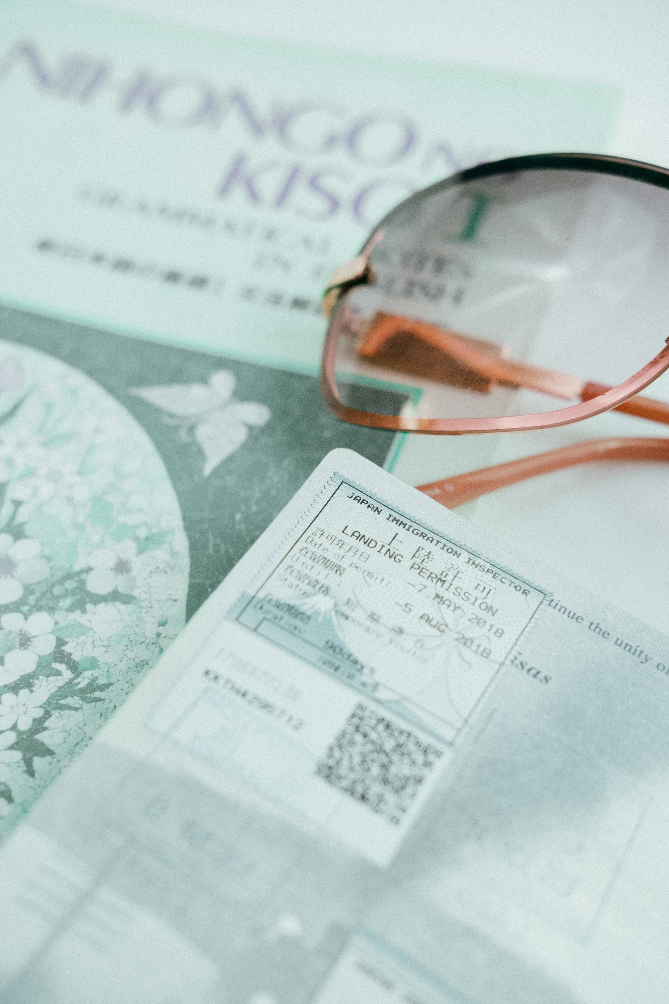Passport and travel documents arranged with sunglasses for visa planning